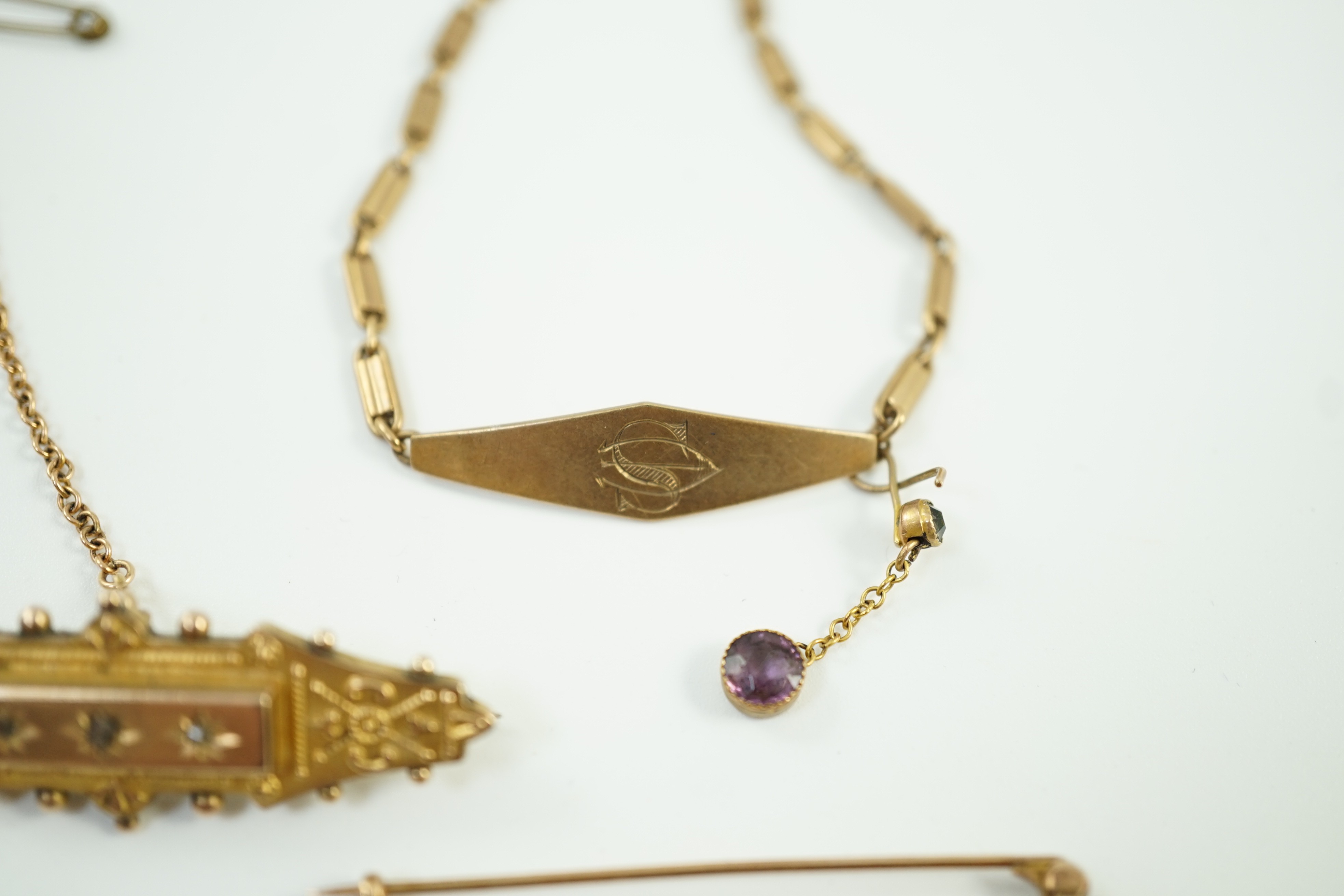 Two early 20th century yellow metal brooches including 9ct and diamond chip set and a seed pearl set bar brooch by Murrle Bennett & Co?, together with a 9ct identity bracelet, gross weight 10.6 grams.